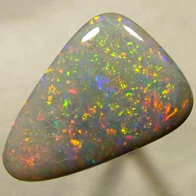 SOLID SEMI BLACK OPAL Large opal with a very 3 dimensional Pinfire pattern with rolling flashes. WITH VIDEO