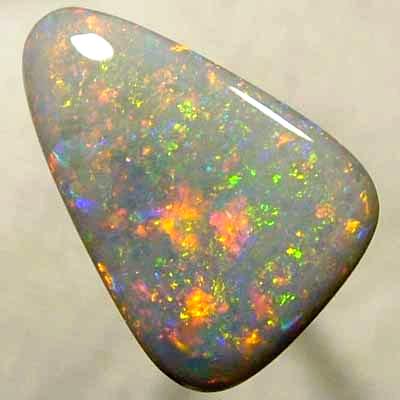 SOLID SEMI BLACK OPAL Large opal with a very 3 dimensional Pinfire pattern with rolling flashes. WITH VIDEO