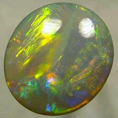 SOLID SEMI BLACK OPAL Very bright neon golds shades moving in large rolling flashes over peacock colours