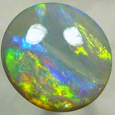 SOLID SEMI BLACK OPAL Very bright neon golds shades moving in large rolling flashes over peacock colours