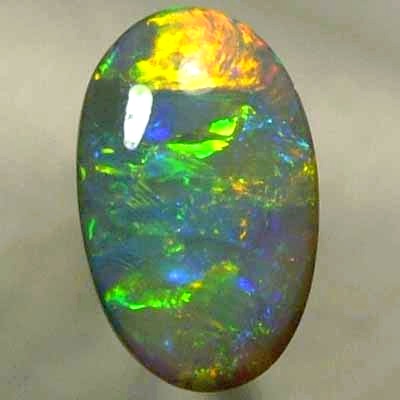 SOLID SEMI BLACK OPAL Glassy rolling flashes of orange and green, blue and yellow. With VIDEO