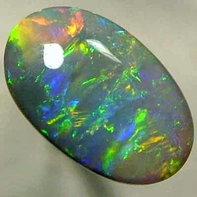 SOLID SEMI BLACK OPAL Glassy rolling flashes of orange and green, blue and yellow. With VIDEO