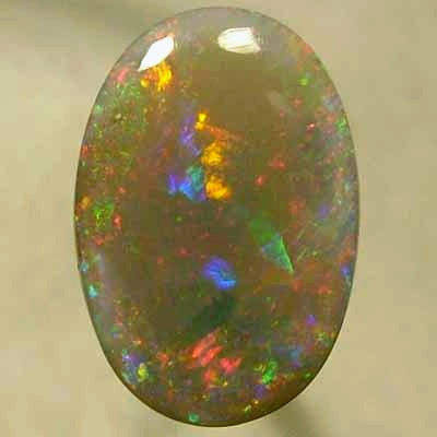 SOLID SEMI BLACK OPAL Large rolling flashes of reds with green and blue. With VIDEO