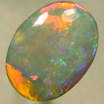 SOLID CRYSTAL OPAL Neon red moves in the cleanest rolling flashes contrasted by crispy green