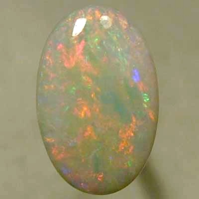 SOLID SEMI BLACK OPAL Candy red mixes with light green and blue, sparkles always.