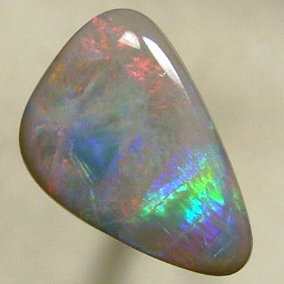 SOLID SEMI BLACK OPAL Large rolling flashes of reds to green to blue to red