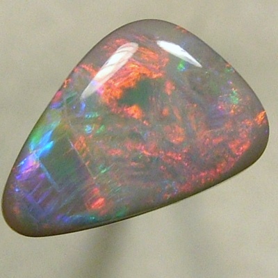 SOLID SEMI BLACK OPAL Large rolling flashes of reds to green to blue to red