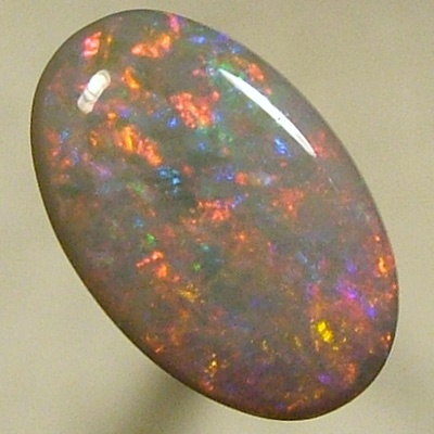 SOLID SEMI BLACK OPAL Pretty opal with red sparkling with blue in between