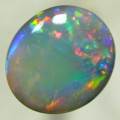 SOLID SEMI BLACK OPAL A red Flame pattern moves over gemmy green