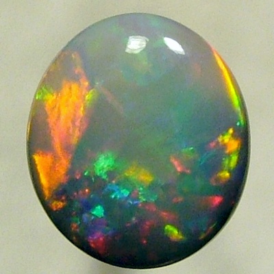 SOLID SEMI BLACK OPAL A red Flame pattern moves over gemmy green