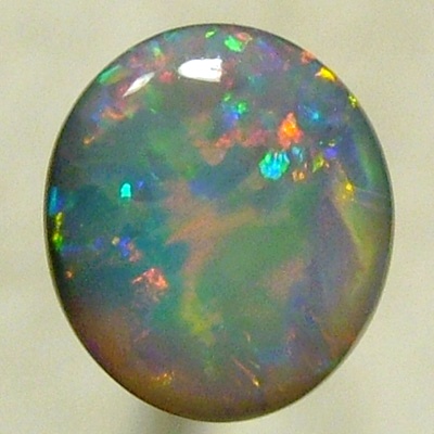 SOLID SEMI BLACK OPAL A red Flame pattern moves over gemmy green
