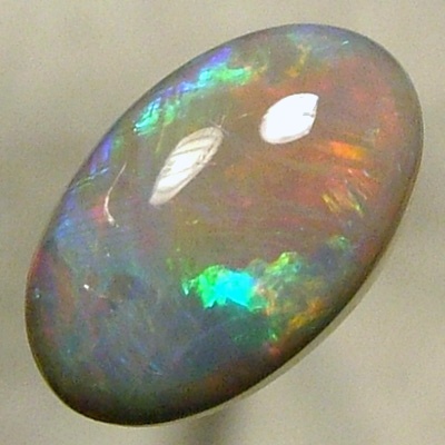 SOLID CRYSTAL OPAL Rolling flashes red to purple, green to blue