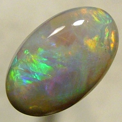 SOLID CRYSTAL OPAL Rolling flashes red to purple, green to blue