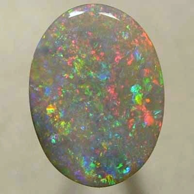 SOLID SEMI BLACK OPAL Red oozes between orange, green and purple
