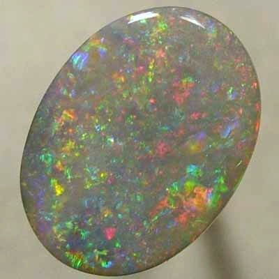 SOLID SEMI BLACK OPAL Red oozes between orange, green and purple