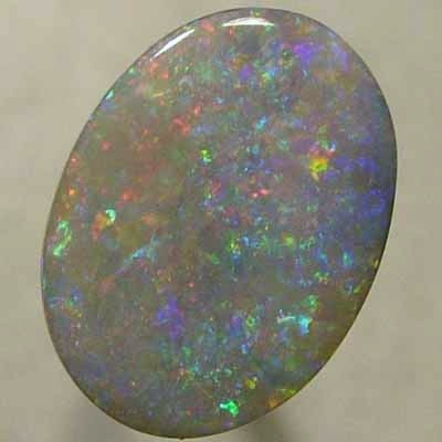 SOLID SEMI BLACK OPAL Red oozes between orange, green and purple