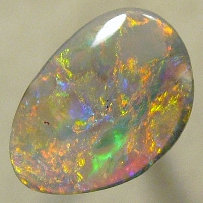 SOLID SEMI BLACK OPAL Very bright with red and orange over green and turquoise