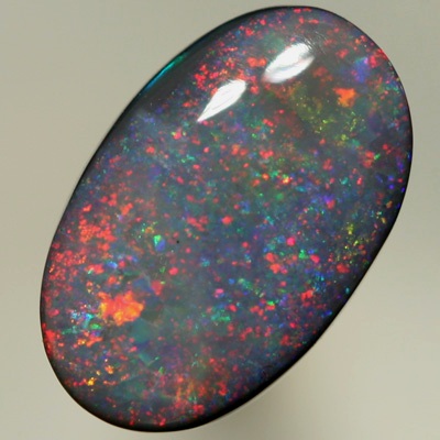 SOLID BLACK OPAL Pretty opal with rolling flashes moving over a Pinfire pattern. SEE VIDEO