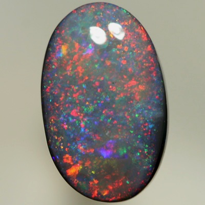 SOLID BLACK OPAL Pretty opal with rolling flashes moving over a Pinfire pattern. SEE VIDEO