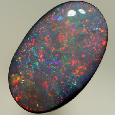 SOLID BLACK OPAL Pretty opal with rolling flashes moving over a Pinfire pattern. SEE VIDEO