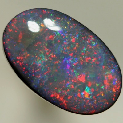 SOLID BLACK OPAL Pretty opal with rolling flashes moving over a Pinfire pattern. SEE VIDEO