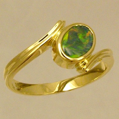 18k Yellow Gold Ring with a BLACK OPAL Orange and green fire jumping all over the face of this bright opal