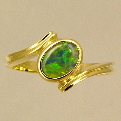 18k Yellow Gold Ring with a BLACK OPAL Orange and green fire jumping all over the face of this bright opal