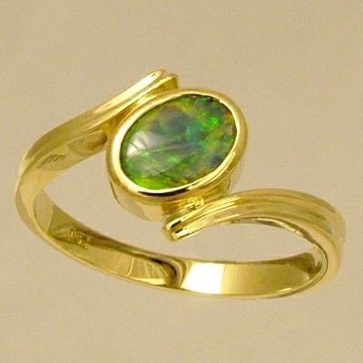 18k Yellow Gold Ring with a BLACK OPAL Orange and green fire jumping all over the face of this bright opal
