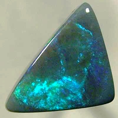SOLID BLACK OPAL Double sides opal with rolling flashes of green shades.