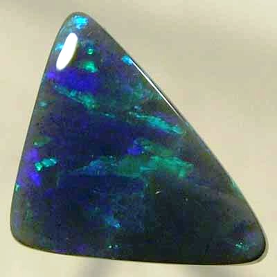 SOLID BLACK OPAL Double sides opal with rolling flashes of green shades.