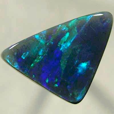 SOLID BLACK OPAL Double sides opal with rolling flashes of green shades.