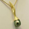 HANDMADE CREATIONS BY SWISS MASTER GOLDSMITH 18 k yellow gold   Australian South Sea Pearl Two pendants in one - Double sided